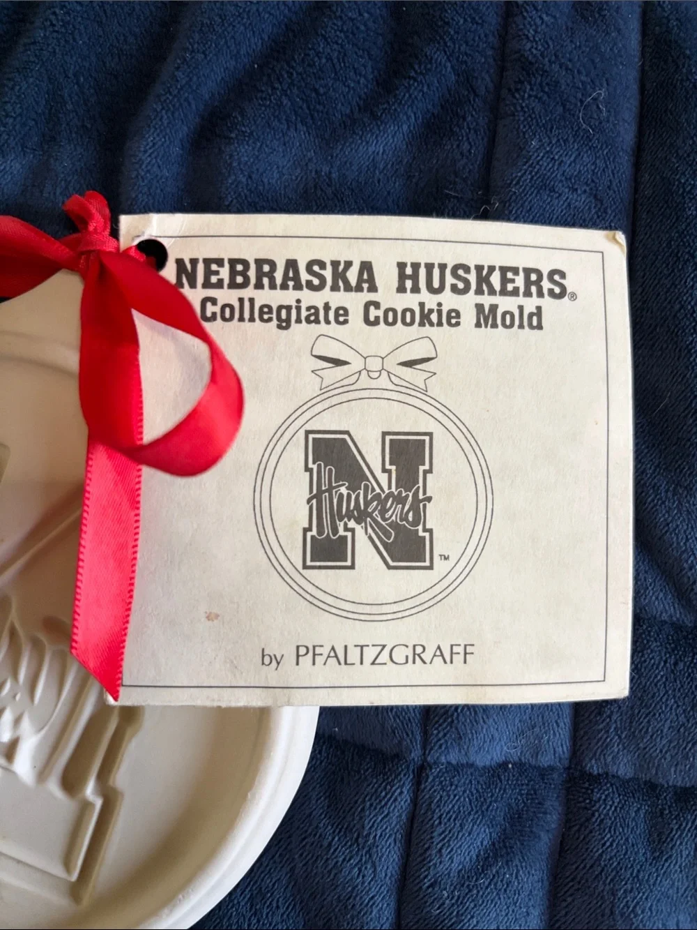 Pfaltzgraff White Nebraska Huskers Cookie Mold with Red Ribbon